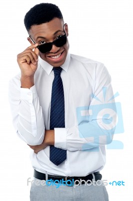 Businessman Adjusting His Sunglasses Stock Photo