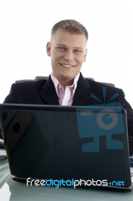 Businessman At Desk With Laptop Stock Photo