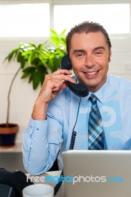 Businessman Attending Phone Call Stock Photo