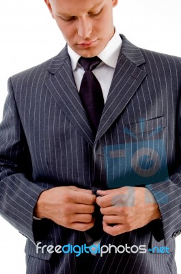 Businessman Buttoning His Jacket Stock Photo