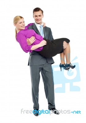 Businessman Carrying His Partner Stock Photo