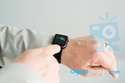 Businessman Checking His Daily Activities Using The Apple Watch Stock Photo