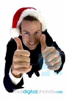 Businessman Cheering With Santa Cap Stock Photo