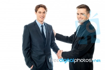 Businessman Congratulating His Partner Stock Photo