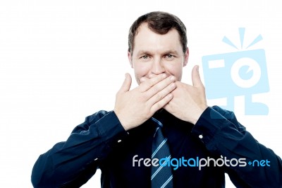 Businessman Covering His Mouth With Hands Stock Photo