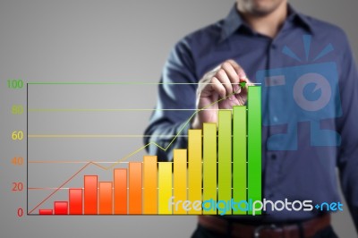 Businessman Drawing Bar Chart Stock Photo