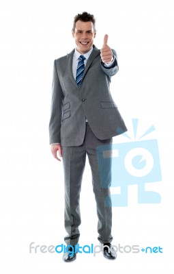 Businessman Gesturing Thumbs Up Stock Photo