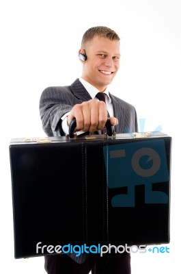 Businessman Giving His Briefcase Stock Photo