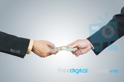 Businessman Hand And Money To Other For Corruption Stock Photo