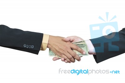 Businessman Hand And Money To Other For Corruption Stock Photo