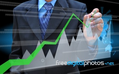 Businessman Hand Drawing Business Graph Stock Photo