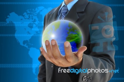 Businessman Hand Holding A World Stock Photo