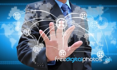 Businessman Hand Pushing Social Network On World Map Stock Photo