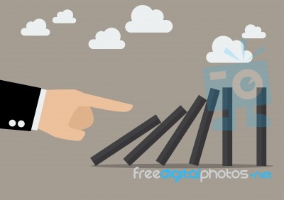 Businessman Hand Pushing The Domino Tiles Stock Image