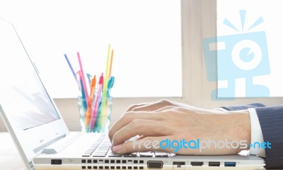 Businessman Hand Typing Laptop Or Notebook In Close Up View In Old Office Stock Photo