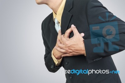 Businessman Having Heart Attack Stock Photo