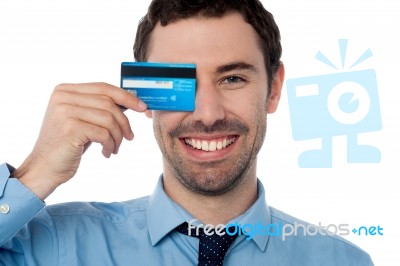 Businessman Hiding His Eye With Credit Card Stock Photo