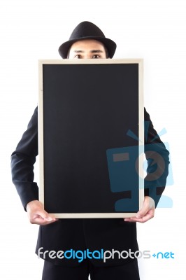 Businessman Holding A Blackboard Stock Photo