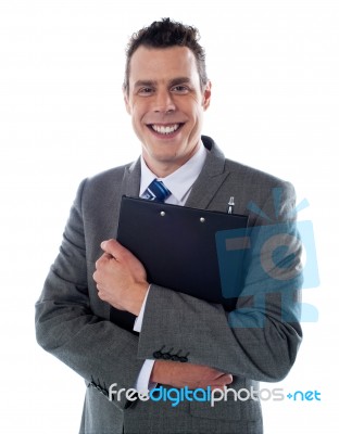 Businessman Holding A Clipboard Stock Photo