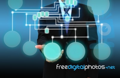 Businessman Holding A Touch Screen Interface Stock Photo