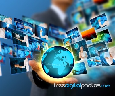 Businessman Holding Business World Stock Photo