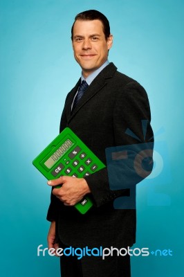 Businessman Holding Calculator Stock Photo