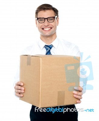 Businessman Holding Cardboard Box Stock Photo