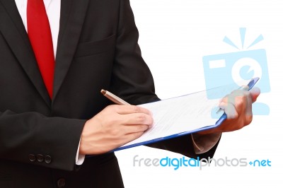 Businessman Holding Clipboard Stock Photo