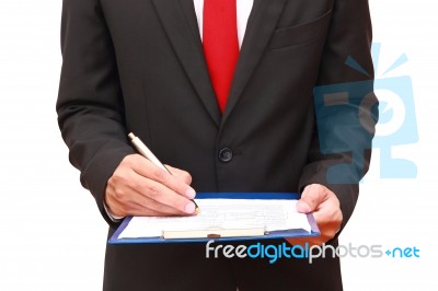 Businessman Holding Clipboard Stock Photo