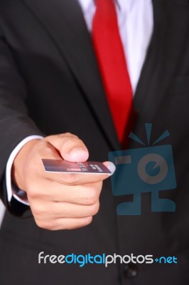 Businessman Holding Credit Card Stock Photo