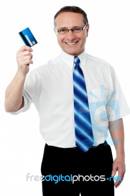 Businessman Holding Credit Card Stock Photo