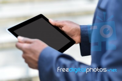 Businessman Holding Digital Tablet Outdoors Stock Photo