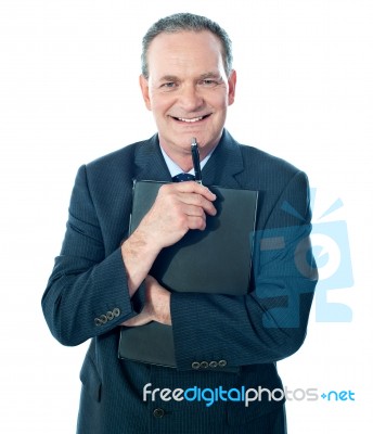 Businessman holding folder Stock Photo