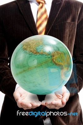 Businessman Holding Globe Stock Photo