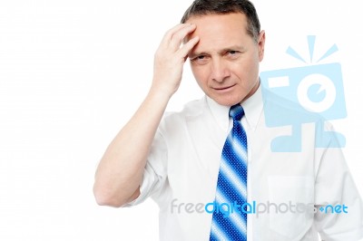 Businessman Holding His Head Stock Photo