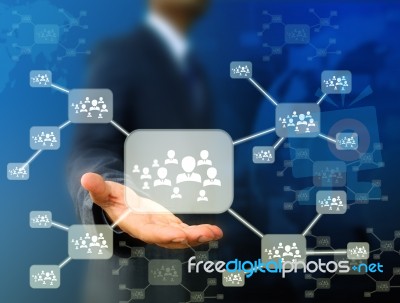 Businessman  Holding  Icon Of Social Network Stock Photo