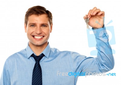 Businessman Holding Key Stock Photo