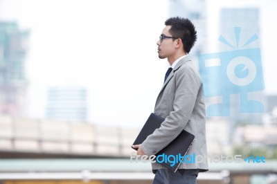 Businessman Holding Laptop Stock Photo