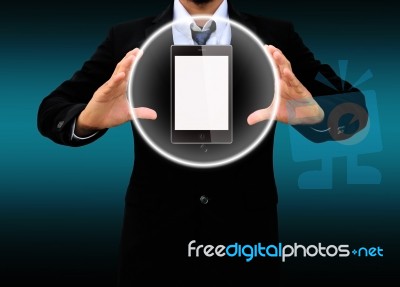 Businessman Holding Mobile Phone Stock Photo