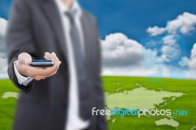 Businessman Holding Mobile Phone Stock Photo