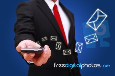 Businessman Holding Smart Phone Stock Photo