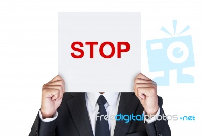 Businessman Holding Stop Paper Stock Photo