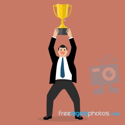 Businessman Holding Up A Winning Trophy Stock Image