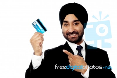 Businessman Holding Up Credit Card Stock Photo