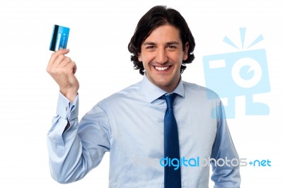 Businessman Holding Up His Credit Card Stock Photo