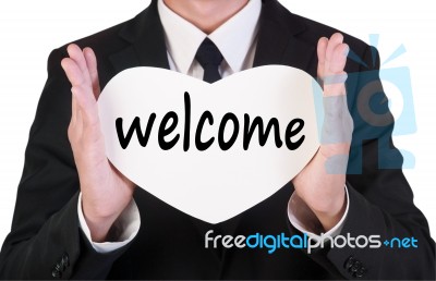 Businessman Holding Welcome Card Stock Photo