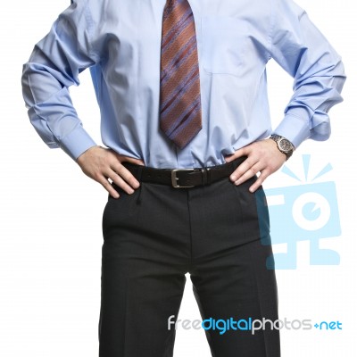 Businessman In Blue Shirt Stands With Hands On The Waist Stock Photo