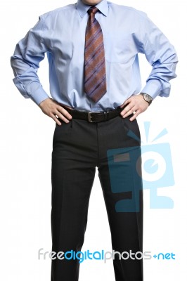 Businessman In Blue Shirt Stands With Hands On The Waist Stock Photo