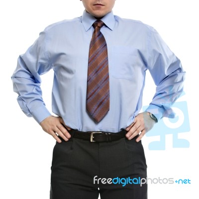 Businessman In Blue Shirt Stands With Hands On The Waist Stock Photo