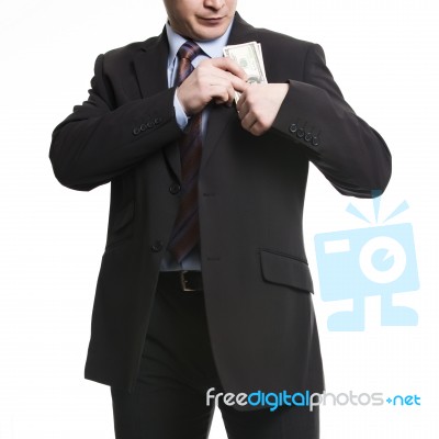 Businessman In Dark Suit Puts A Bunch Of American Dollars Into J… Stock Photo